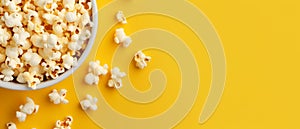 Top view popcorn on yellow pastel background. Movie cinema time concept.