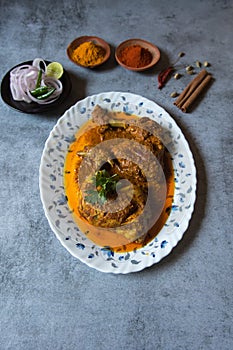 Top view of popular mughal cuisine chicken chap in a serving plate