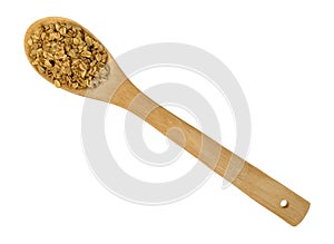 Top view of a portion of brown sugar oat granola on a spoon