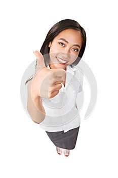 Top view portrait of smiling asian woman thumbs up isolated