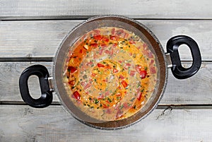 Top view on pot of tomato soup