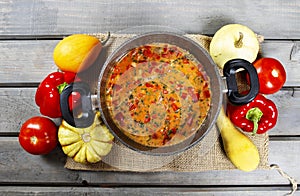 Top view on pot of tomato soup