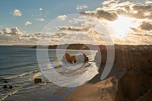 Top view of the Praia dos Careanos at sunset in Portimao, Portugal