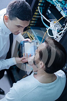 Top view of professional engineers discussing work