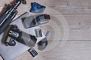 Top view of professional photography gear on the top of a wooden table