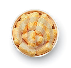 Top view of puffed corn snack in ceramic bowl