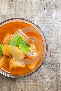 Top view of radish in sour soup made of tamarind