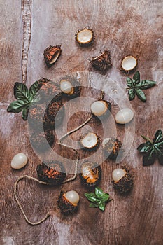 top view of rambutans with green leaves on rustic