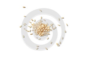 A top view of raw brown and white rice, forming a heap. The integral, uncooked