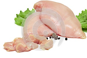 Top view of raw chicken fillet chunks on white