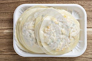 raw corn cakes with pork