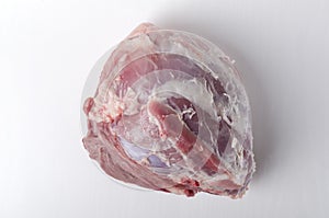 Top view of raw pork ham on th white background.Fresh and juicy meat