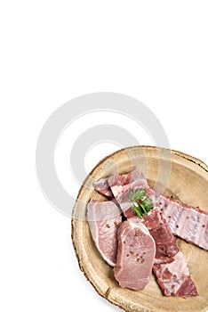 Top view raw pork on wooden dish.