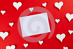 top view with red background with hearts for writing a love lett