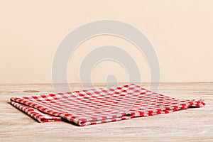 top view with red empty kitchen napkin  on table background. Folded cloth for mockup with copy space, Flat lay