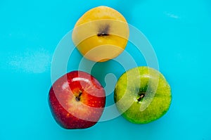 Top view of Red, green and yellow apple different in color on a