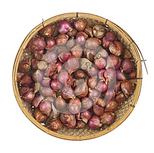 Top view of red onion in weaven basket which ventilated for keep prolong photo