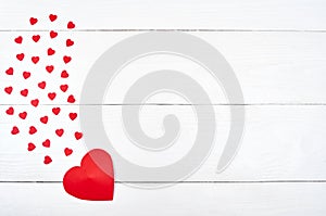 Top view of red paper hearts border on white wooden background, copy space for text. Greeting card mockup for Valentines Day
