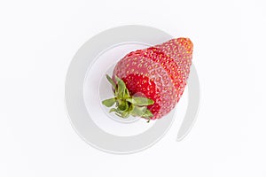 top view of red, ripe, juicy strawberries on a white background.