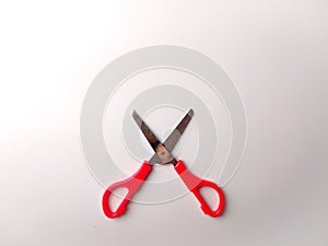 Top view red scissors on the middle