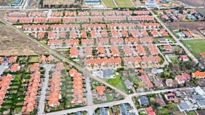 Top view of red tiled roofs of townhouse, modern private houses