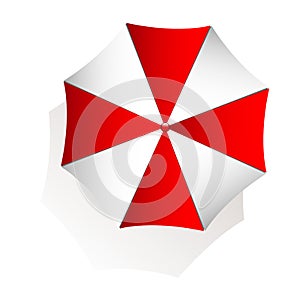 Top view of red and white beach umbrella on white