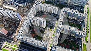 Top view of residential and construction areas. Motion. Bright contrast of dirty area under construction and new