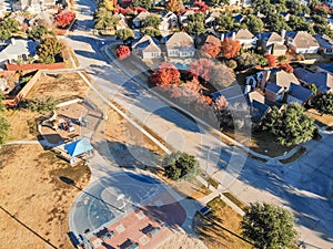 Top view residential playground with colorful fall leaves near D