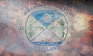 Top view of retro county of Garrett, Maryland flag with grunge texture, USA, no flagpole. Plane design, layout. Flag background