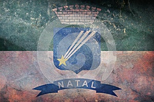 Top view of retro flag Natal, Brazil with grunge texture. Brazilian travel and patriot concept. no flagpole. Plane design, layout
