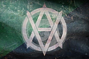 Top view of retro flag of Veganarchism, whiteVA with grunge texture. Anarchism symbol. no flagpole. Plane design, layout. Flag photo