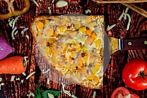 Top view reversed photo of delicious sweet and spicy pizza slice with pineapple, mango, hot sausage and mozzarella cheese