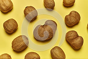 Top view of ripe kiwis isolated on a yellow background