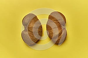 Top view of ripe kiwis isolated on a yellow background