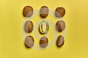 Top view of ripe kiwis isolated on a yellow background