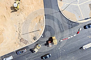 Top view of road construction with road rollers doing asphalt pavement works