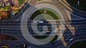 Top view of road traffic at round roads intersection