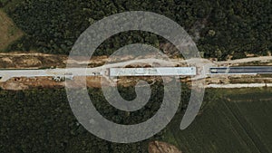 Top view of a road under construction in Brcko district surrounded by forests