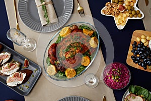 Top View of Roasted Turkey with Vegetables Served on Table for Christmas Dinner photo
