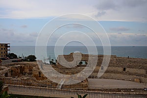 Top view of the Roman amphitheatre of Tarraco in Tarragona against the sea and sky, Catalonia photo