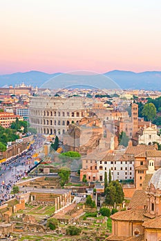 Top view of Rome city skyline with Colosseum and Roman Forum