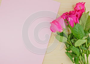 Top view rose bouquet on wooden background