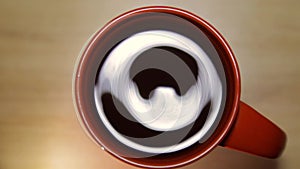 Top view rotating tea in a cup