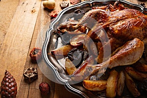 Top view of round dish with baked turkey, potato and mushrooms. Festive dinner for Thanksgiving day. Concept of traditional recipe