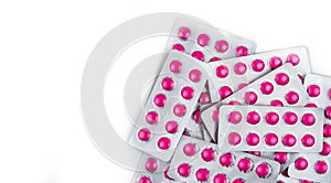 Top view of round pink tablets pills in blister packs on white background with copy space. Ibuprofen tablets pills for relief pain