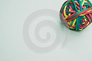 Top view of a rubber ball made out of rubber bands isolated on a white background