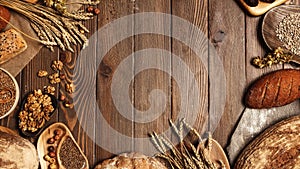 Top view of Rye, wheat and multigrain rustic bread loaves over dark wooden