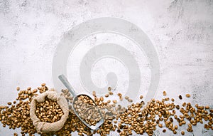 Top view of a sack of coffee beans on a white background with copyspace