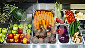 Top view of salad bar with assortment of ingredients for healthy and diet meal