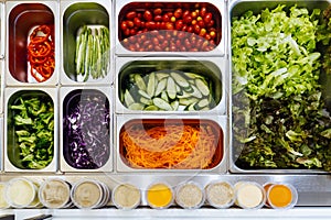 Top view of salad bar with assortment of ingredients. For healthy and diet meal